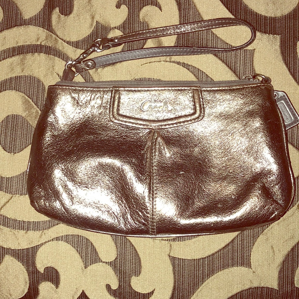 Silver coach wristlet clutch
